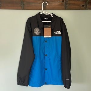The North Face boys lightweight jacket, black / blue coaches jacket size medium